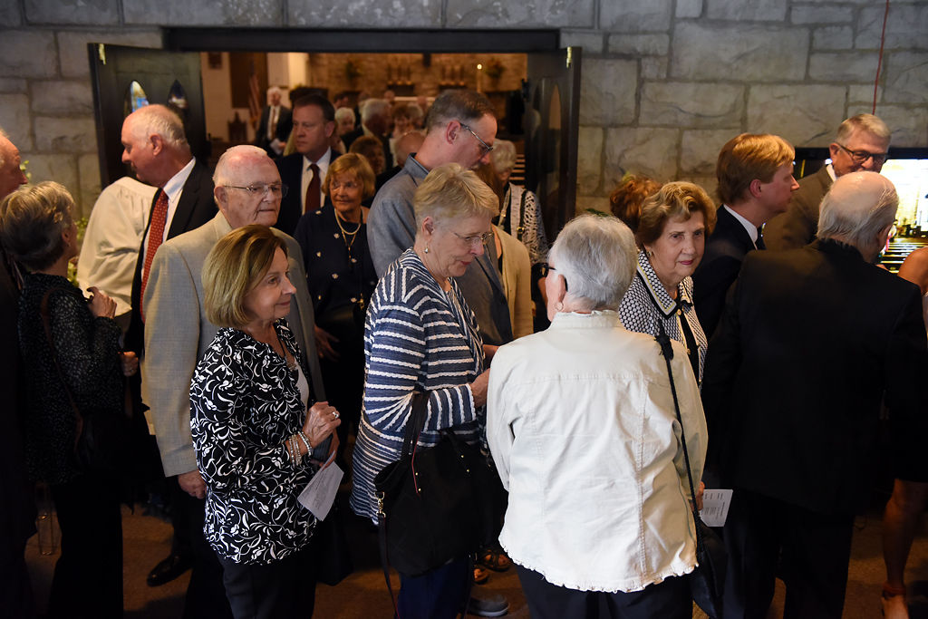 Friends, family, and Columbia residents make their way toward the reception